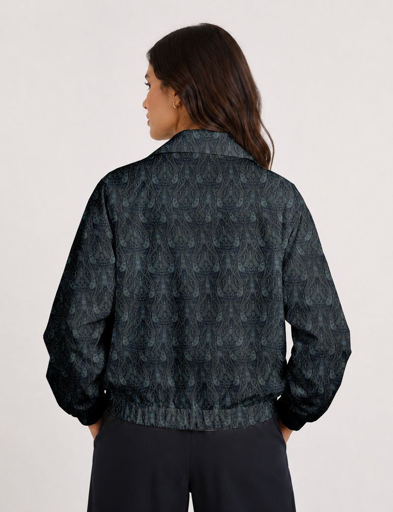 Brown floral bomber jacket with front zipper, elastic cuffs and hem, hanging on white hanger, red floral inner lining visible