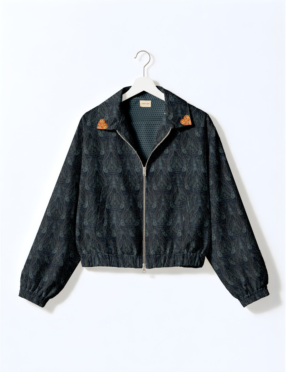 Love Bomber Jacket made from recycled fabric, featuring hand-stitched Aari embroidery. A unique piece of zero-waste clothing, part of the circular fashion movement. Designed with upcycled materials for a stylish yet environmentally friendly clothing choice.