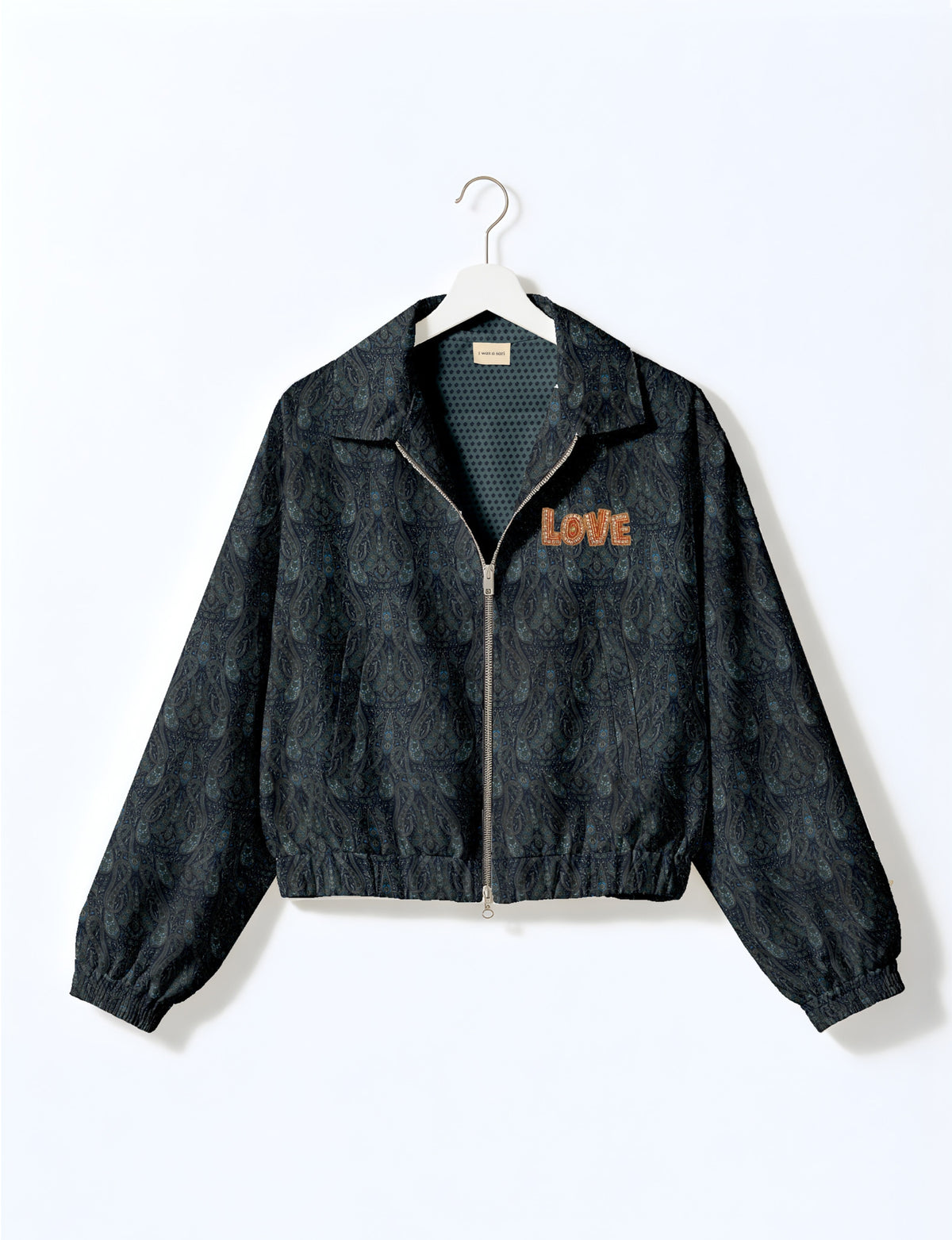 Love Bomber Jacket made from recycled fabric, featuring hand-stitched Aari embroidery. A unique piece of zero-waste clothing, part of the circular fashion movement. Designed with upcycled materials for a stylish yet environmentally friendly clothing choice.