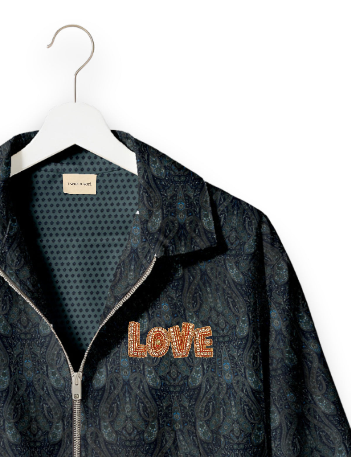 Love Bomber Jacket made from recycled fabric, featuring hand-stitched Aari embroidery. A unique piece of zero-waste clothing, part of the circular fashion movement. Designed with upcycled materials for a stylish yet environmentally friendly clothing choice.