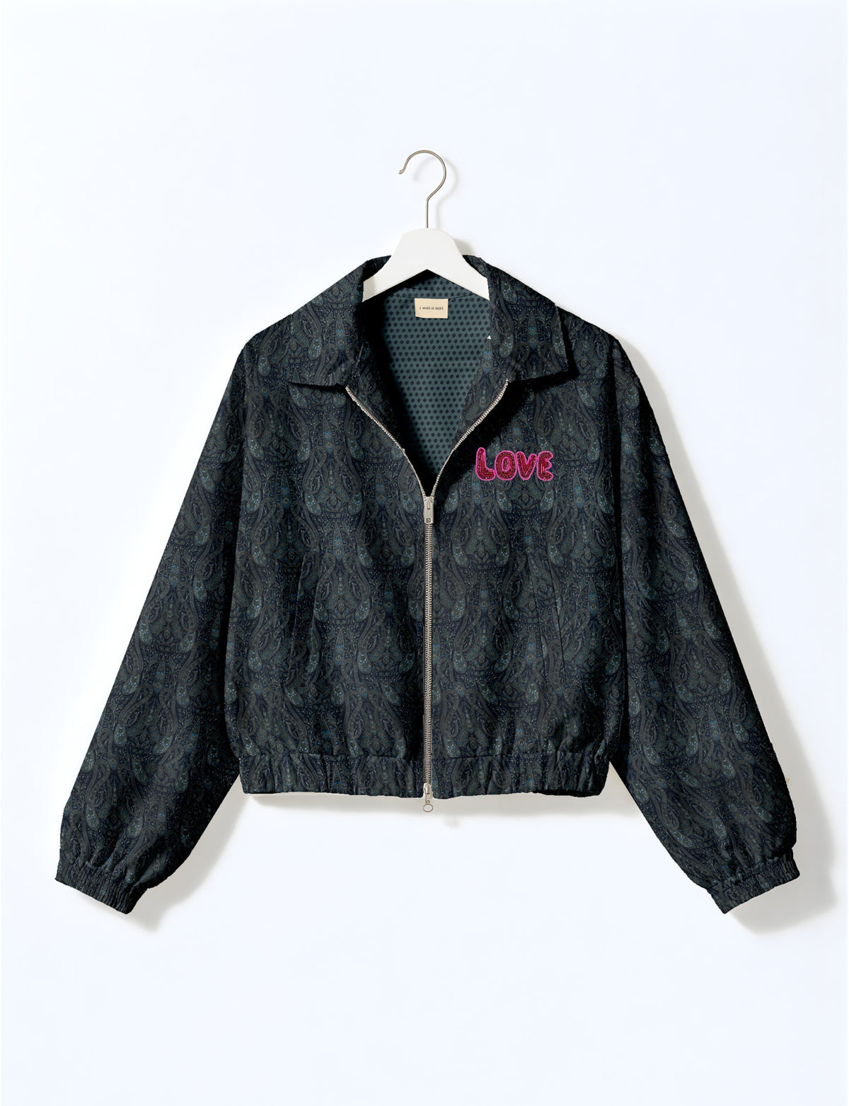 Love Bomber Jacket made from recycled fabric, featuring hand-stitched Aari embroidery. A unique piece of zero-waste clothing, part of the circular fashion movement. Designed with upcycled materials for a stylish yet environmentally friendly clothing choice.