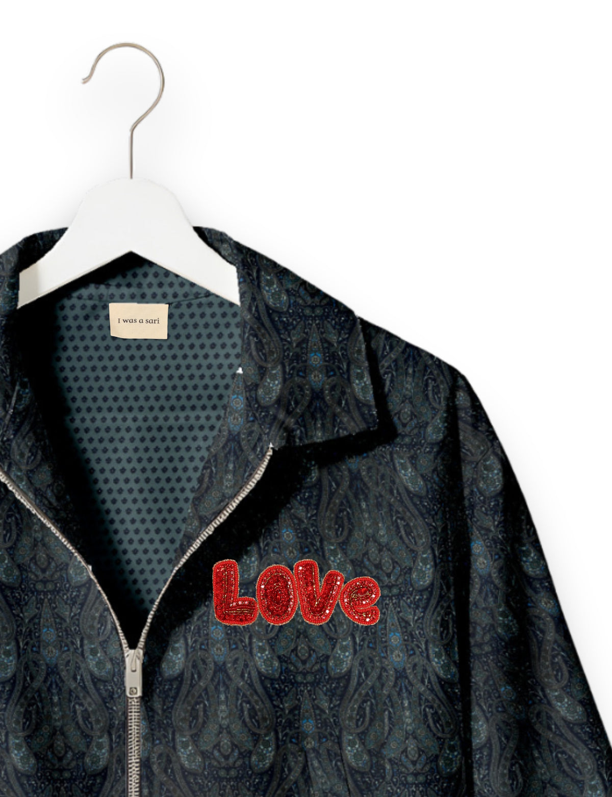 Love Bomber Jacket made from recycled fabric, featuring hand-stitched Aari embroidery. A unique piece of zero-waste clothing, part of the circular fashion movement. Designed with upcycled materials for a stylish yet environmentally friendly clothing choice.