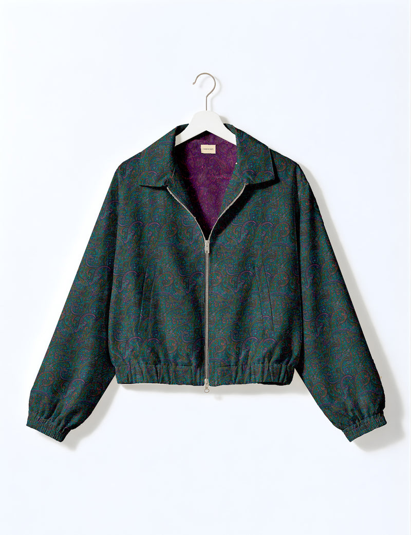 Brown floral bomber jacket with front zipper, elastic cuffs and hem, hanging on white hanger, red floral inner lining visible