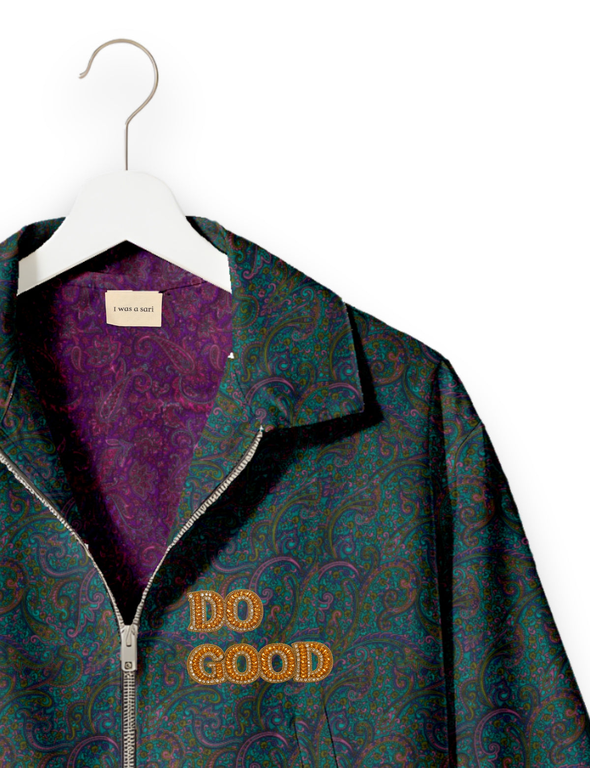 Gold cropped DO GOOD bomber jacket featuring hand-embroidered lettering on the left chest, contrasting inner lining and two functional pockets.