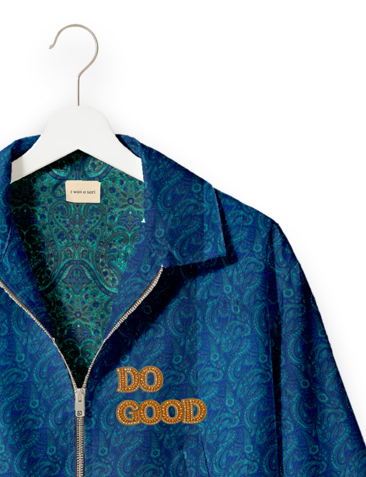 Gold cropped DO GOOD bomber jacket featuring hand-embroidered lettering on the left chest, contrasting inner lining and two functional pockets.