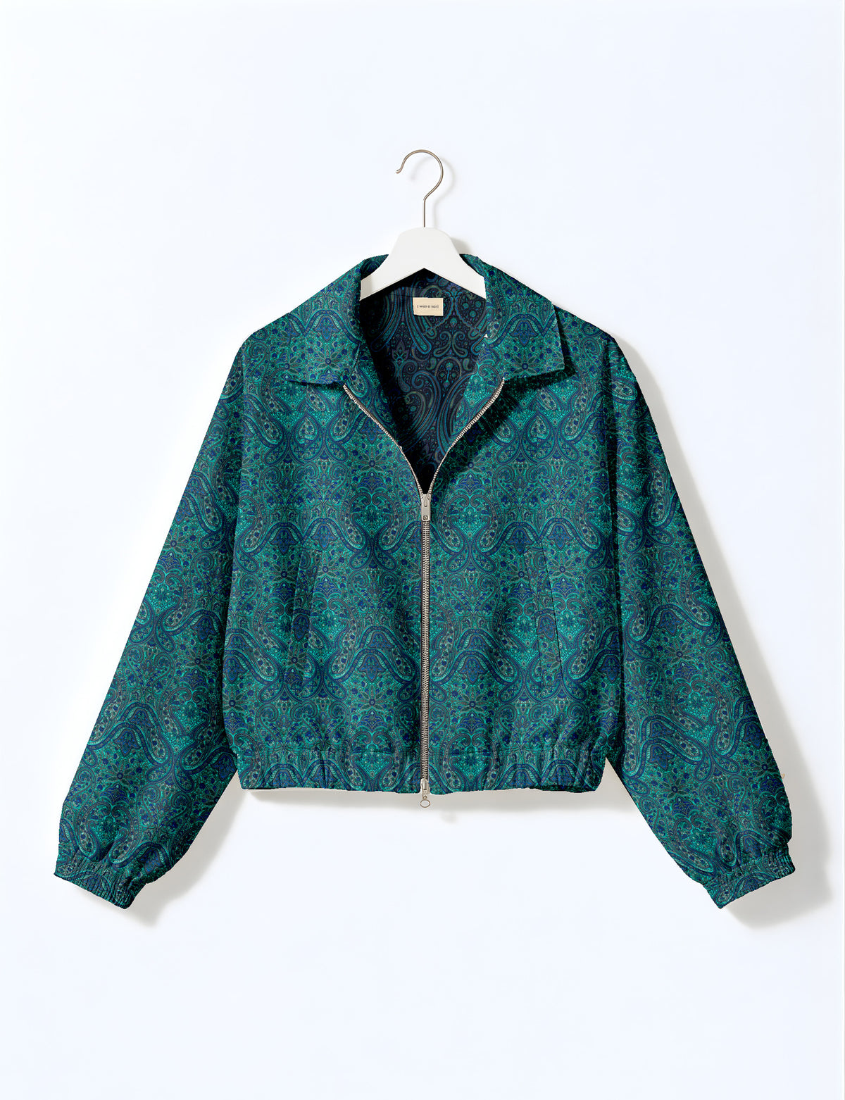 Brown floral bomber jacket with front zipper, elastic cuffs and hem, hanging on white hanger, red floral inner lining visible