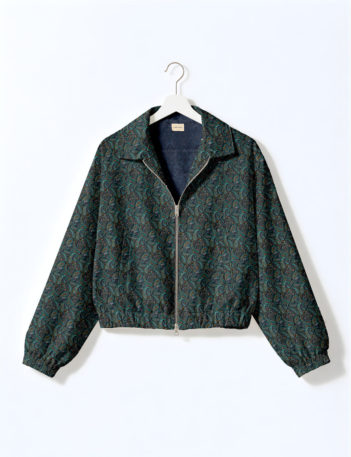 Brown floral bomber jacket with front zipper, elastic cuffs and hem, hanging on white hanger, red floral inner lining visible