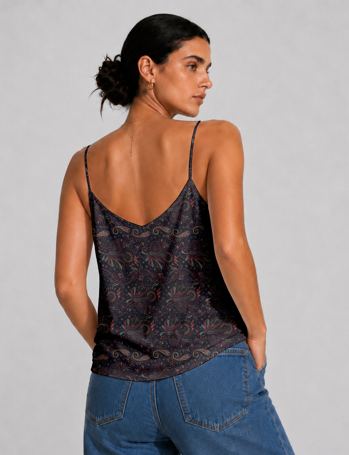 Women's sleeveless slip top with a relaxed straight fit, soft V-neckline, deep V-back, and delicate spaghetti straps.