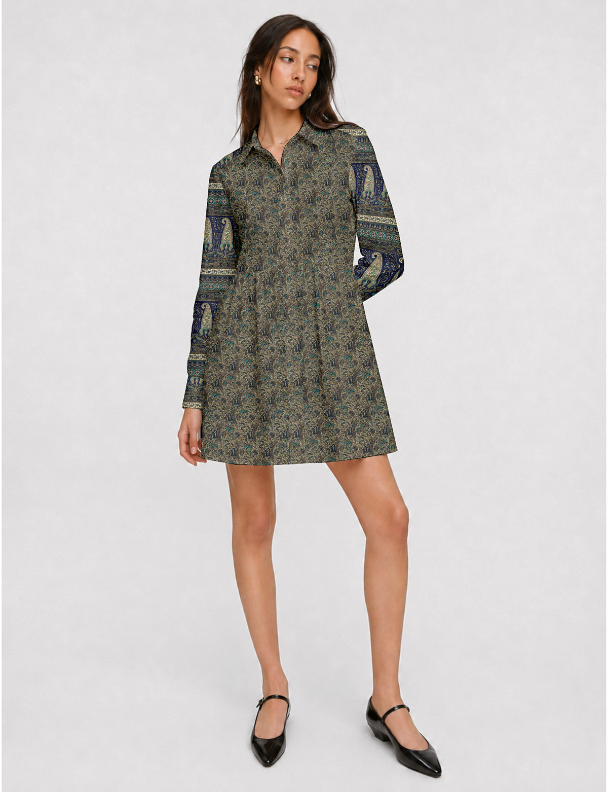 Short shirt dress with a relaxed A-line silhouette, point collar, partial button placket, gathered waist, side pockets, and full-length cuffed sleeves.