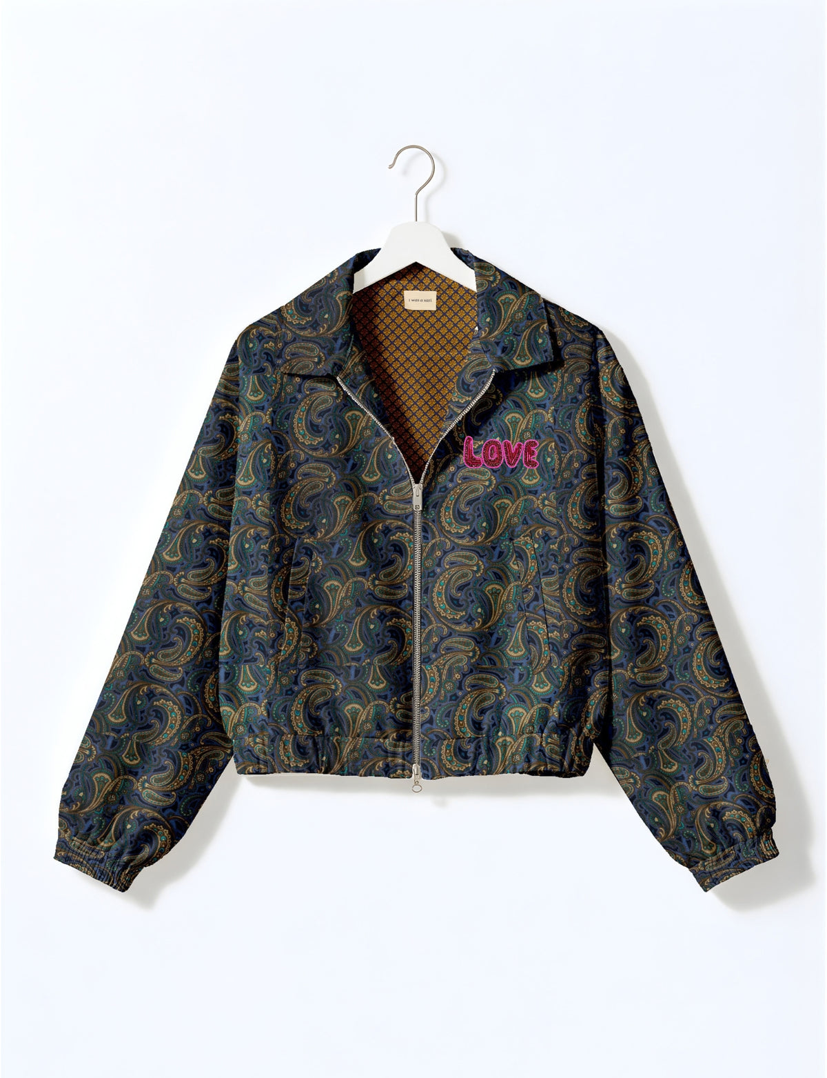 Love Bomber Jacket made from recycled fabric, featuring hand-stitched Aari embroidery. A unique piece of zero-waste clothing, part of the circular fashion movement. Designed with upcycled materials for a stylish yet environmentally friendly clothing choice.
