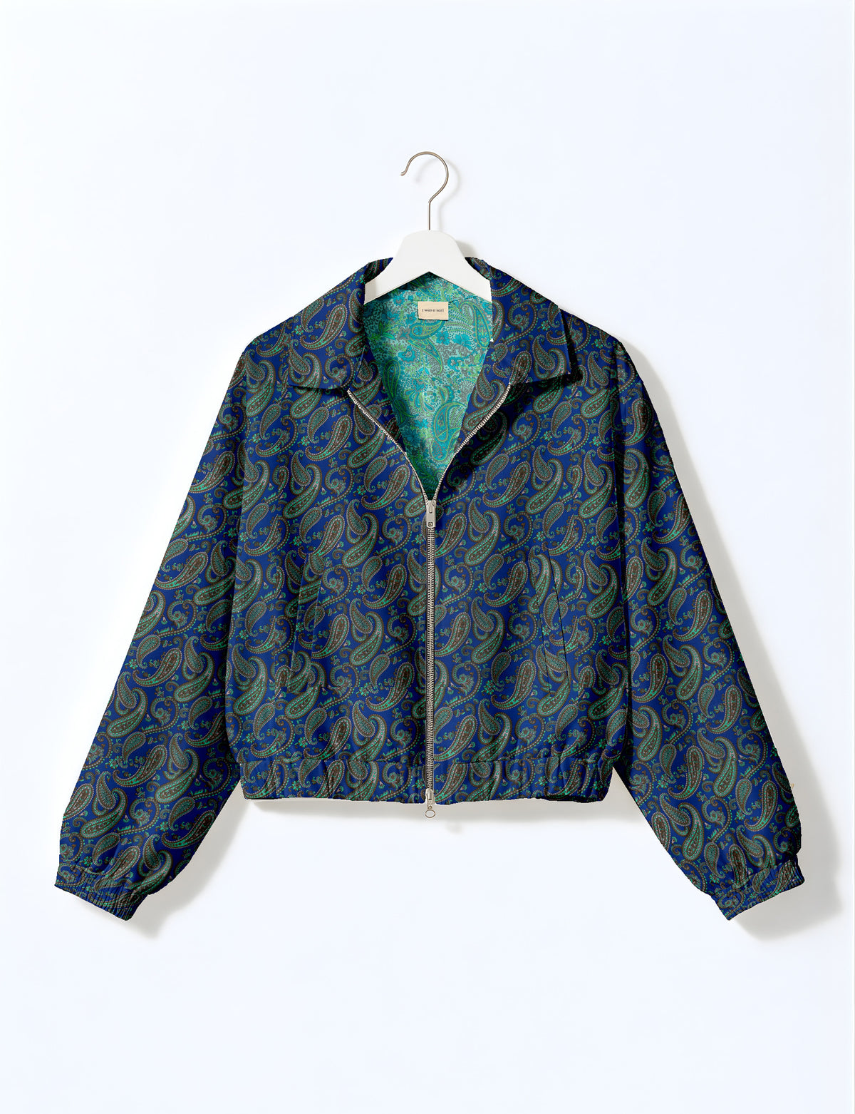 Woman wearing a yellow floral bomber jacket with front zipper, elastic cuffs, and side pockets, shown from front view