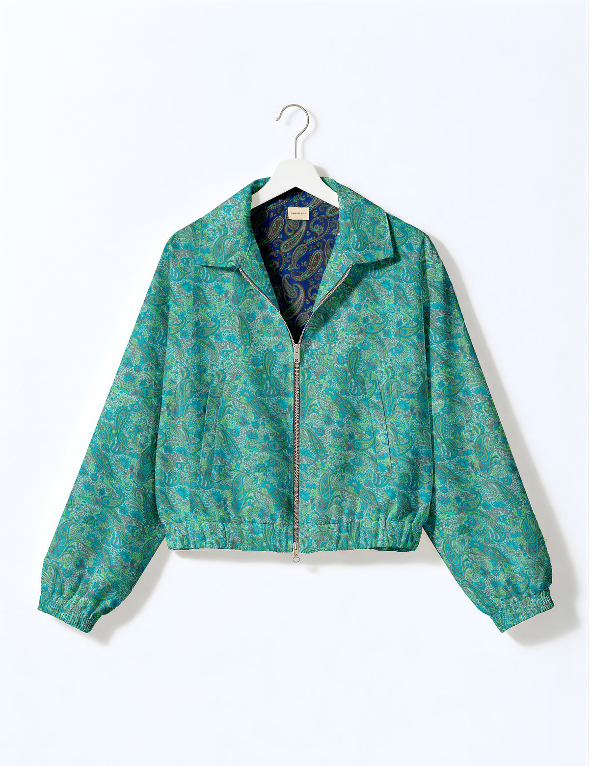 Woman wearing a yellow floral bomber jacket with front zipper, elastic cuffs, and side pockets, shown from front view
