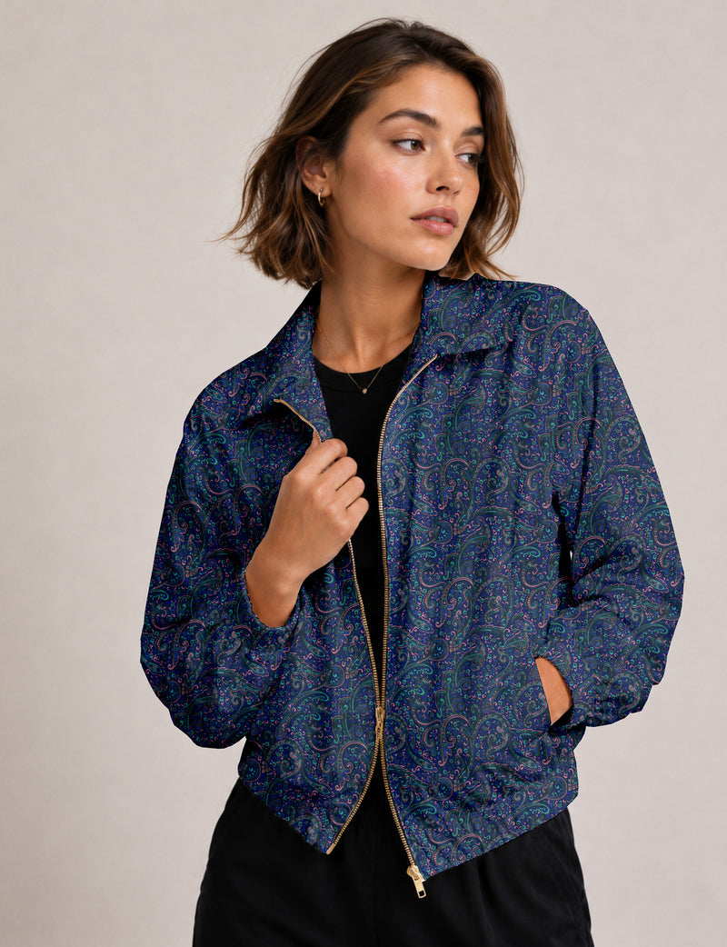 Brown floral bomber jacket with front zipper, elastic cuffs and hem, hanging on white hanger, red floral inner lining visible