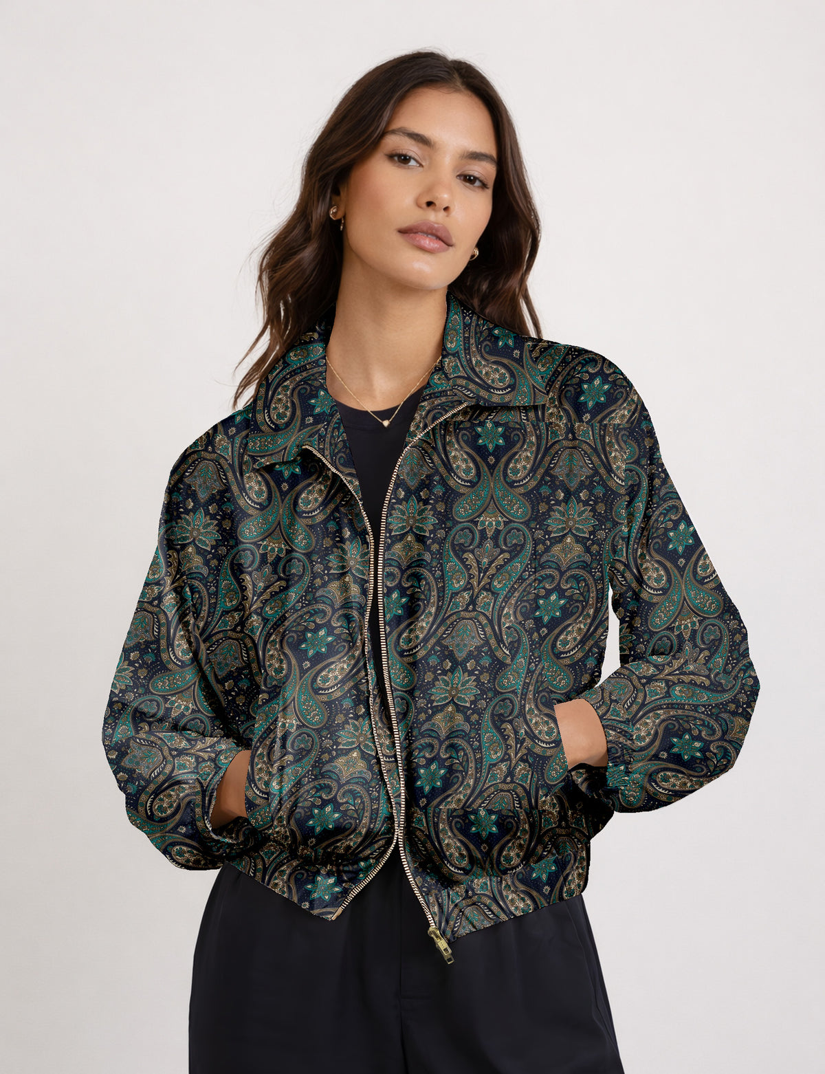Woman wearing a yellow floral bomber jacket with front zipper, elastic cuffs, and side pockets, shown from front view