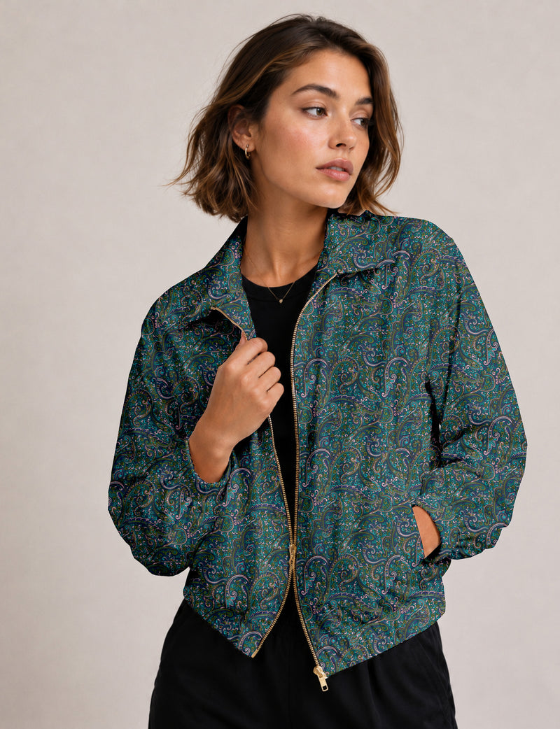 Brown floral bomber jacket with front zipper, elastic cuffs and hem, hanging on white hanger, red floral inner lining visible