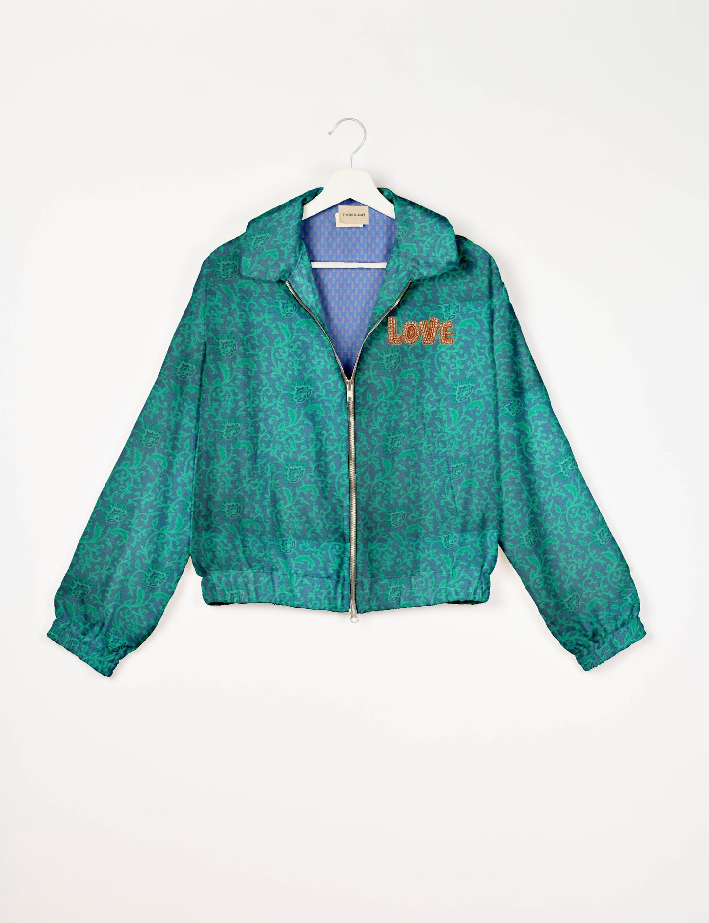 Love Bomber Jacket made from recycled fabric, featuring hand-stitched Aari embroidery. A unique piece of zero-waste clothing, part of the circular fashion movement. Designed with upcycled materials for a stylish yet environmentally friendly clothing choice.