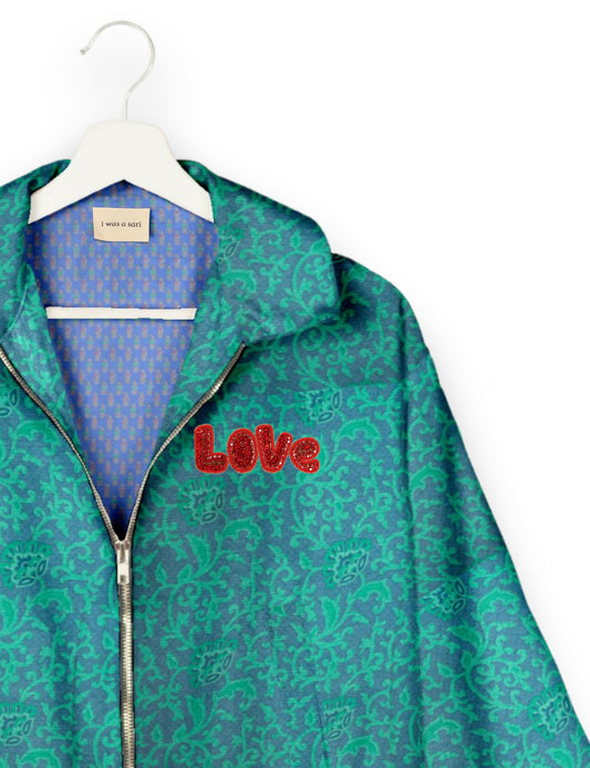 Love Bomber Jacket made from recycled fabric, featuring hand-stitched Aari embroidery. A unique piece of zero-waste clothing, part of the circular fashion movement. Designed with upcycled materials for a stylish yet environmentally friendly clothing choice.