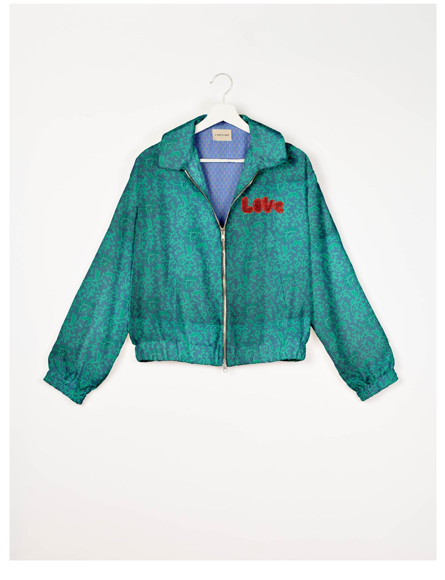 Love Bomber Jacket made from recycled fabric, featuring hand-stitched Aari embroidery. A unique piece of zero-waste clothing, part of the circular fashion movement. Designed with upcycled materials for a stylish yet environmentally friendly clothing choice.