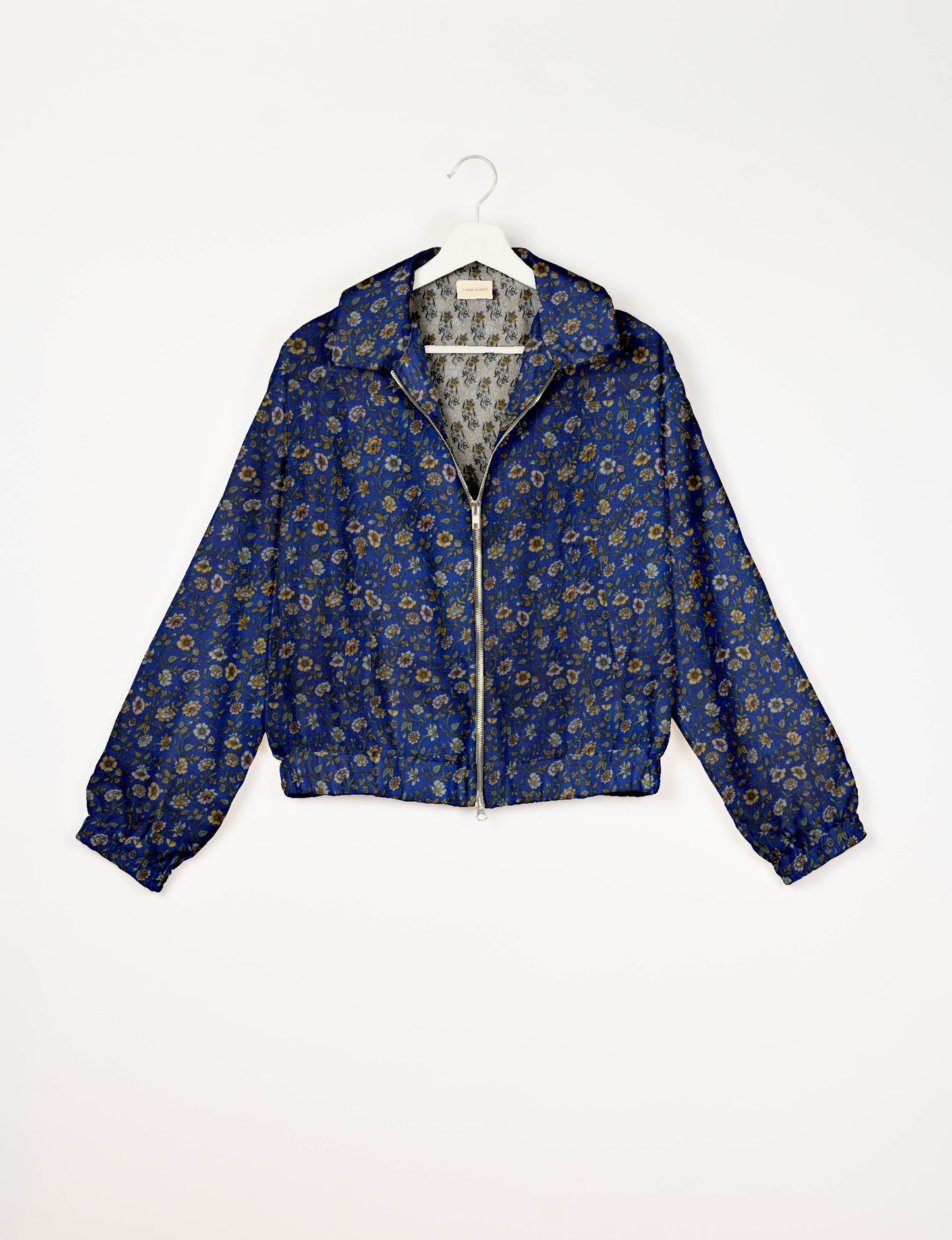 Upcycled Bomber Jacket made from recycled sari materials, featuring a cute cropped shape, elasticated hem and cuffs, and contrast sari print lining. Sustainable apparel promoting eco-friendly fashion and ethical clothing.
