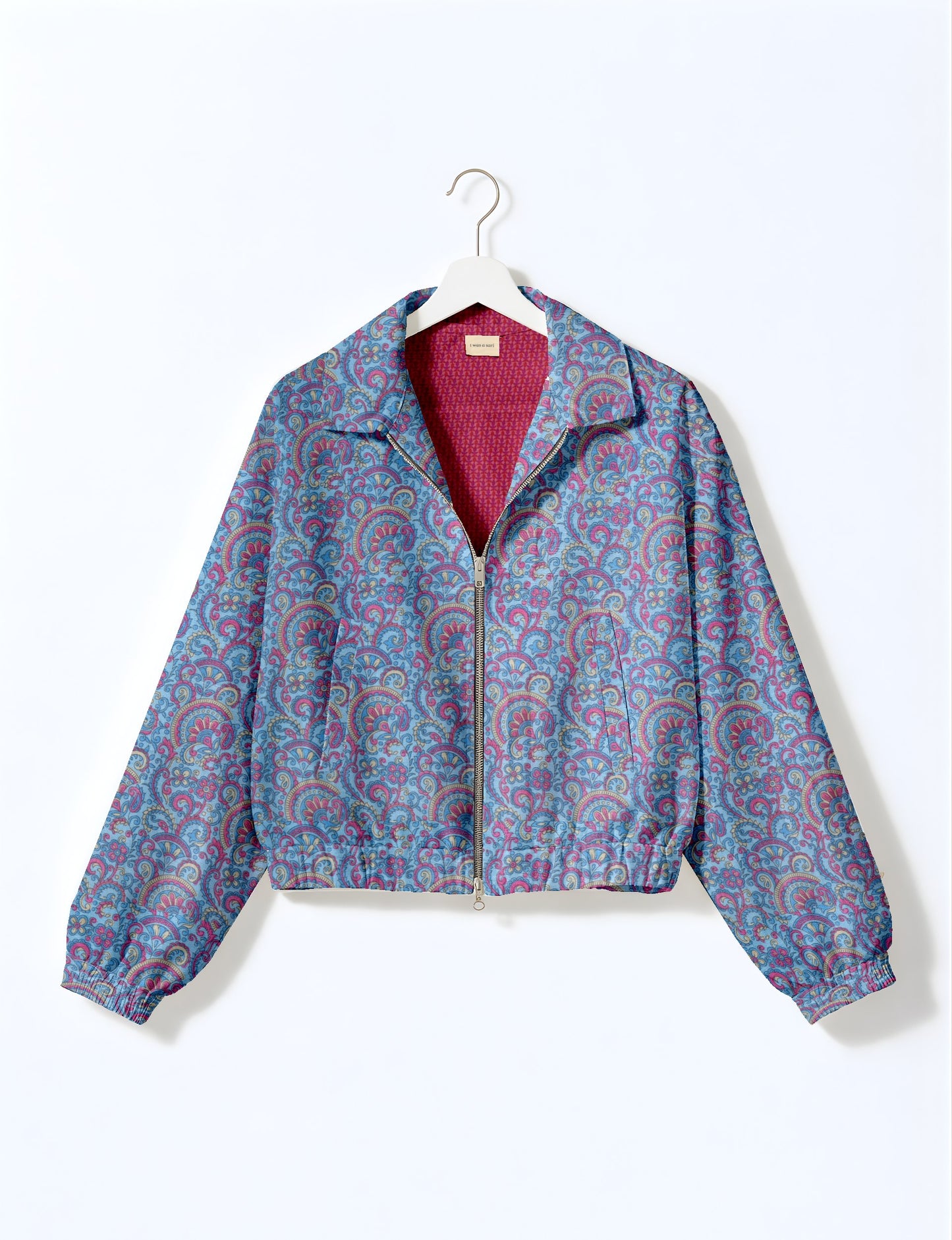 Upcycled Bomber Jacket made from recycled sari materials, featuring a cute cropped shape, elasticated hem and cuffs, and contrast sari print lining. Sustainable apparel promoting eco-friendly fashion and ethical clothing.
