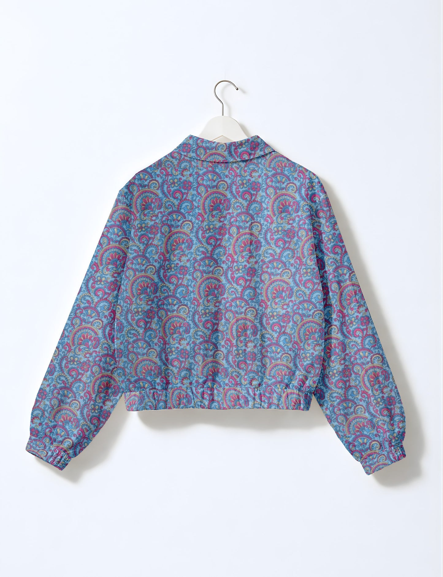 Upcycled Bomber Jacket made from recycled sari materials, featuring a cute cropped shape, elasticated hem and cuffs, and contrast sari print lining. Sustainable apparel promoting eco-friendly fashion and ethical clothing.