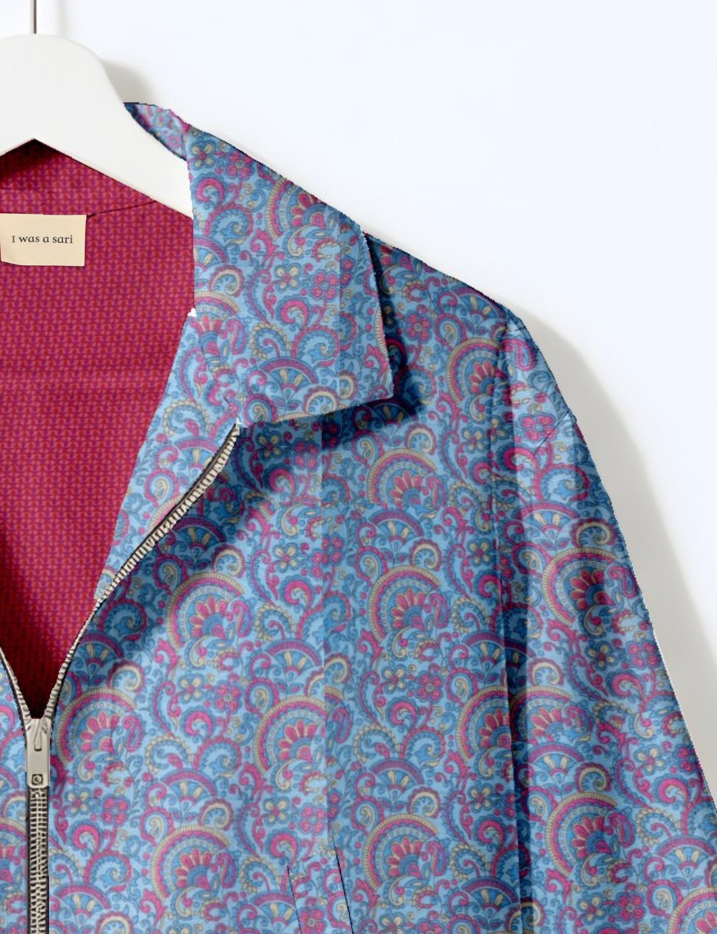 Upcycled Bomber Jacket made from recycled sari materials, featuring a cute cropped shape, elasticated hem and cuffs, and contrast sari print lining. Sustainable apparel promoting eco-friendly fashion and ethical clothing.