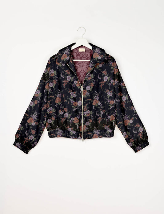 Upcycled Bomber Jacket made from recycled sari materials, featuring a cute cropped shape, elasticated hem and cuffs, and contrast sari print lining. Sustainable apparel promoting eco-friendly fashion and ethical clothing.