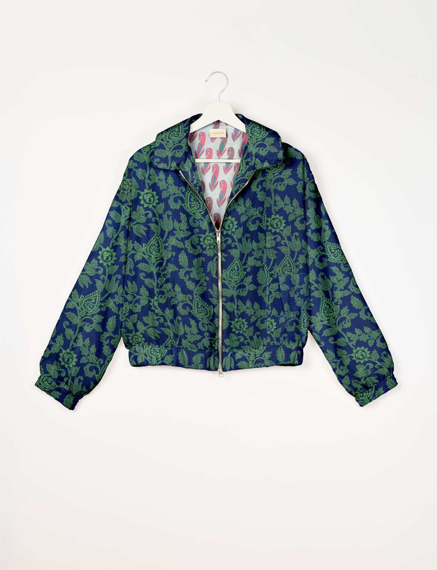 Upcycled Bomber Jacket made from recycled sari materials, featuring a cute cropped shape, elasticated hem and cuffs, and contrast sari print lining. Sustainable apparel promoting eco-friendly fashion and ethical clothing.