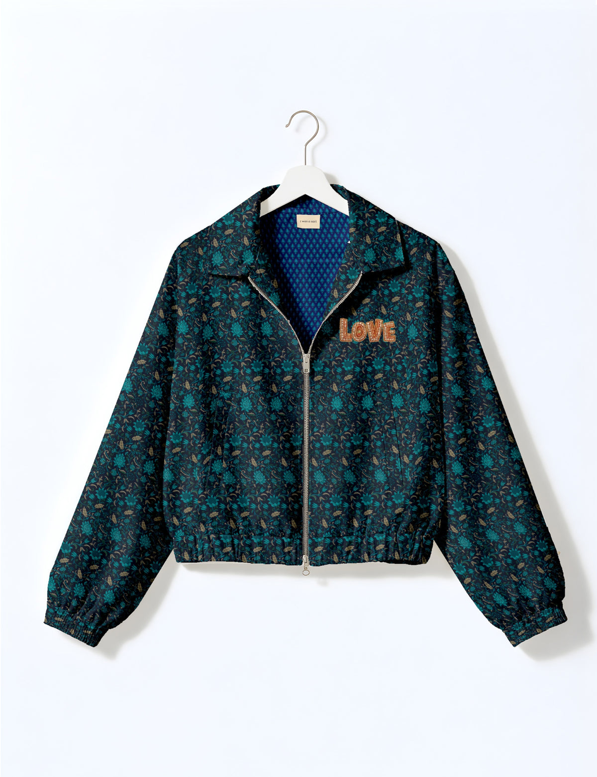 Love Bomber Jacket made from recycled fabric, featuring hand-stitched Aari embroidery. A unique piece of zero-waste clothing, part of the circular fashion movement. Designed with upcycled materials for a stylish yet environmentally friendly clothing choice.