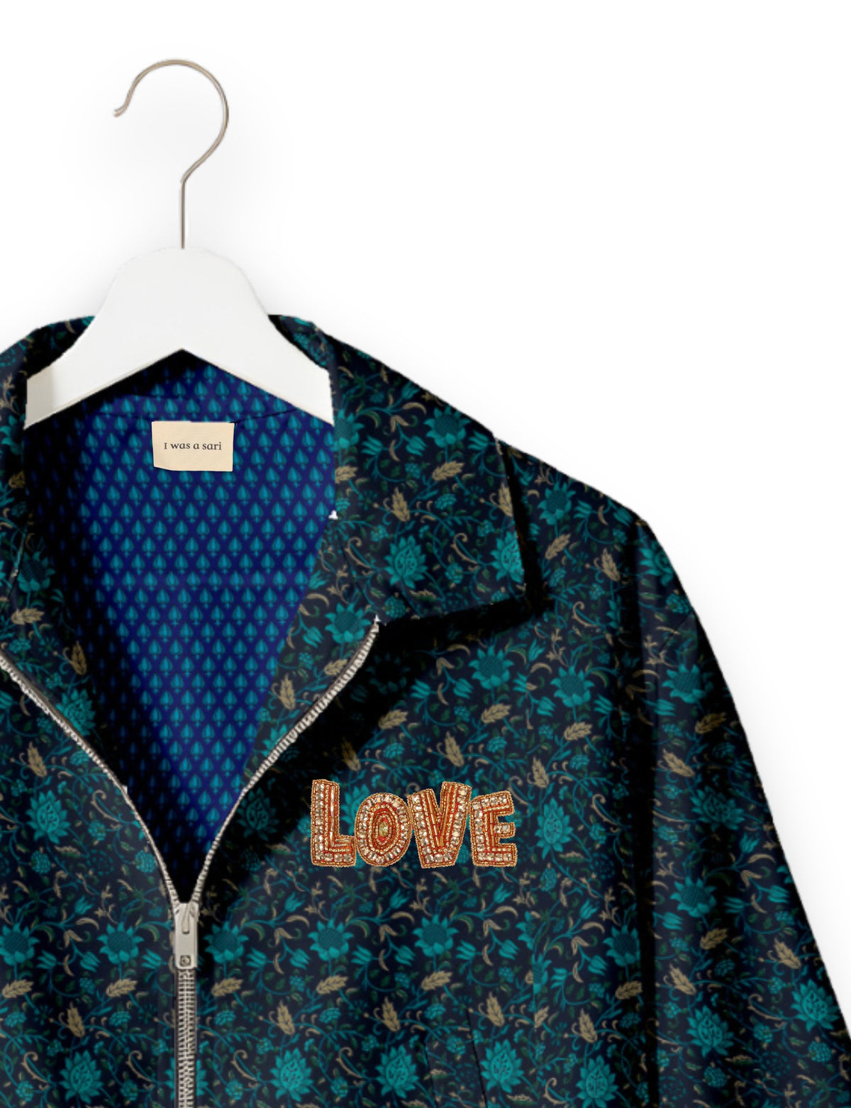 Love Bomber Jacket made from recycled fabric, featuring hand-stitched Aari embroidery. A unique piece of zero-waste clothing, part of the circular fashion movement. Designed with upcycled materials for a stylish yet environmentally friendly clothing choice.