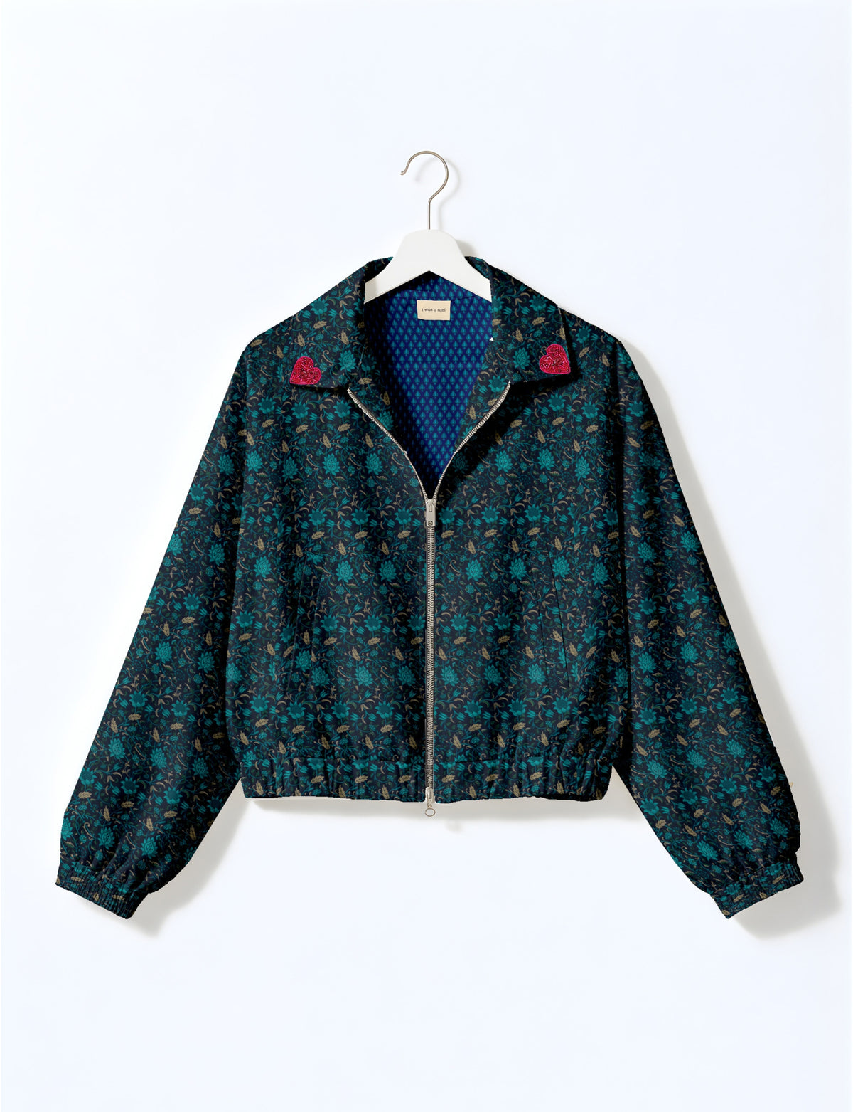 Love Bomber Jacket made from recycled fabric, featuring hand-stitched Aari embroidery. A unique piece of zero-waste clothing, part of the circular fashion movement. Designed with upcycled materials for a stylish yet environmentally friendly clothing choice.