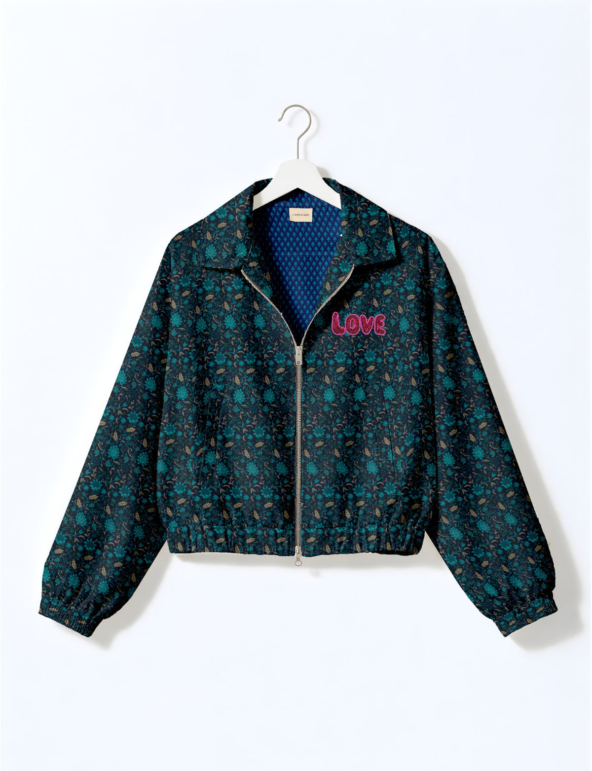 Love Bomber Jacket made from recycled fabric, featuring hand-stitched Aari embroidery. A unique piece of zero-waste clothing, part of the circular fashion movement. Designed with upcycled materials for a stylish yet environmentally friendly clothing choice.