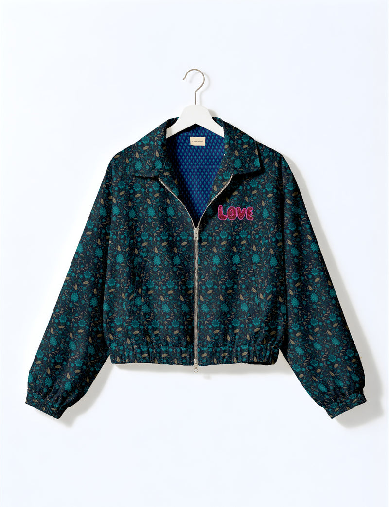 Love Bomber Jacket made from recycled fabric, featuring hand-stitched Aari embroidery. A unique piece of zero-waste clothing, part of the circular fashion movement. Designed with upcycled materials for a stylish yet environmentally friendly clothing choice.