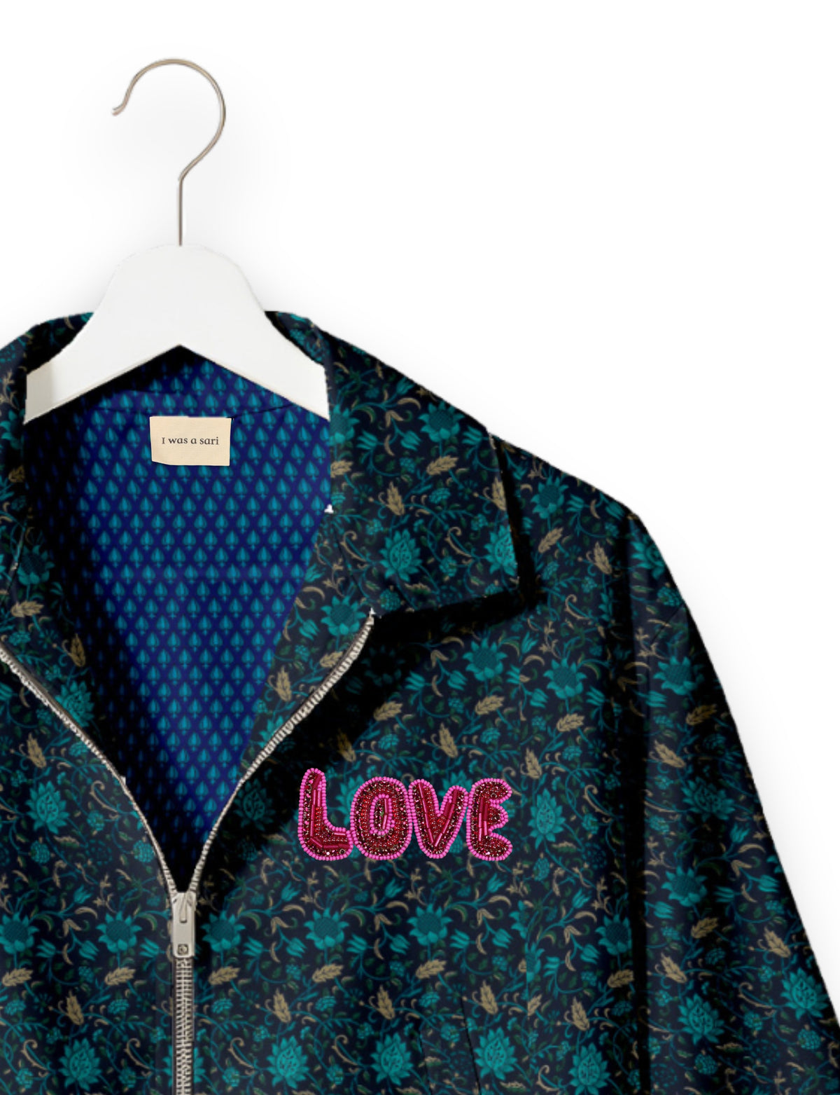 Love Bomber Jacket made from recycled fabric, featuring hand-stitched Aari embroidery. A unique piece of zero-waste clothing, part of the circular fashion movement. Designed with upcycled materials for a stylish yet environmentally friendly clothing choice.