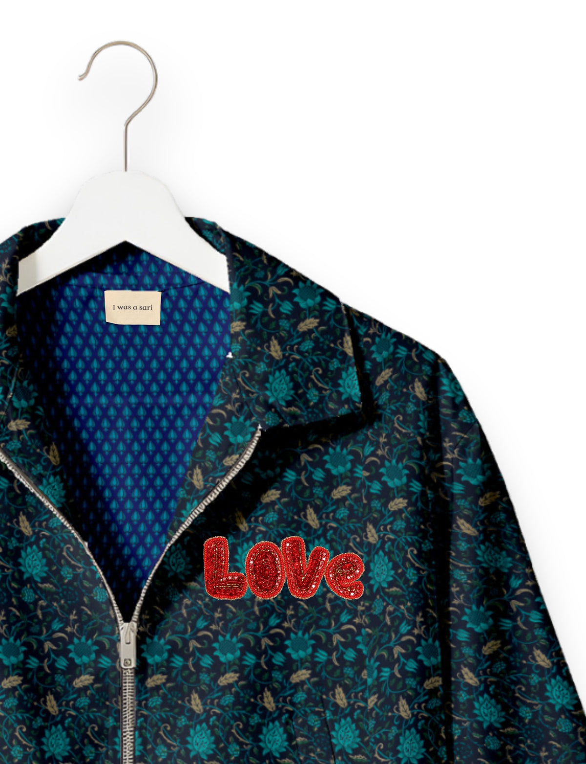 Love Bomber Jacket made from recycled fabric, featuring hand-stitched Aari embroidery. A unique piece of zero-waste clothing, part of the circular fashion movement. Designed with upcycled materials for a stylish yet environmentally friendly clothing choice.