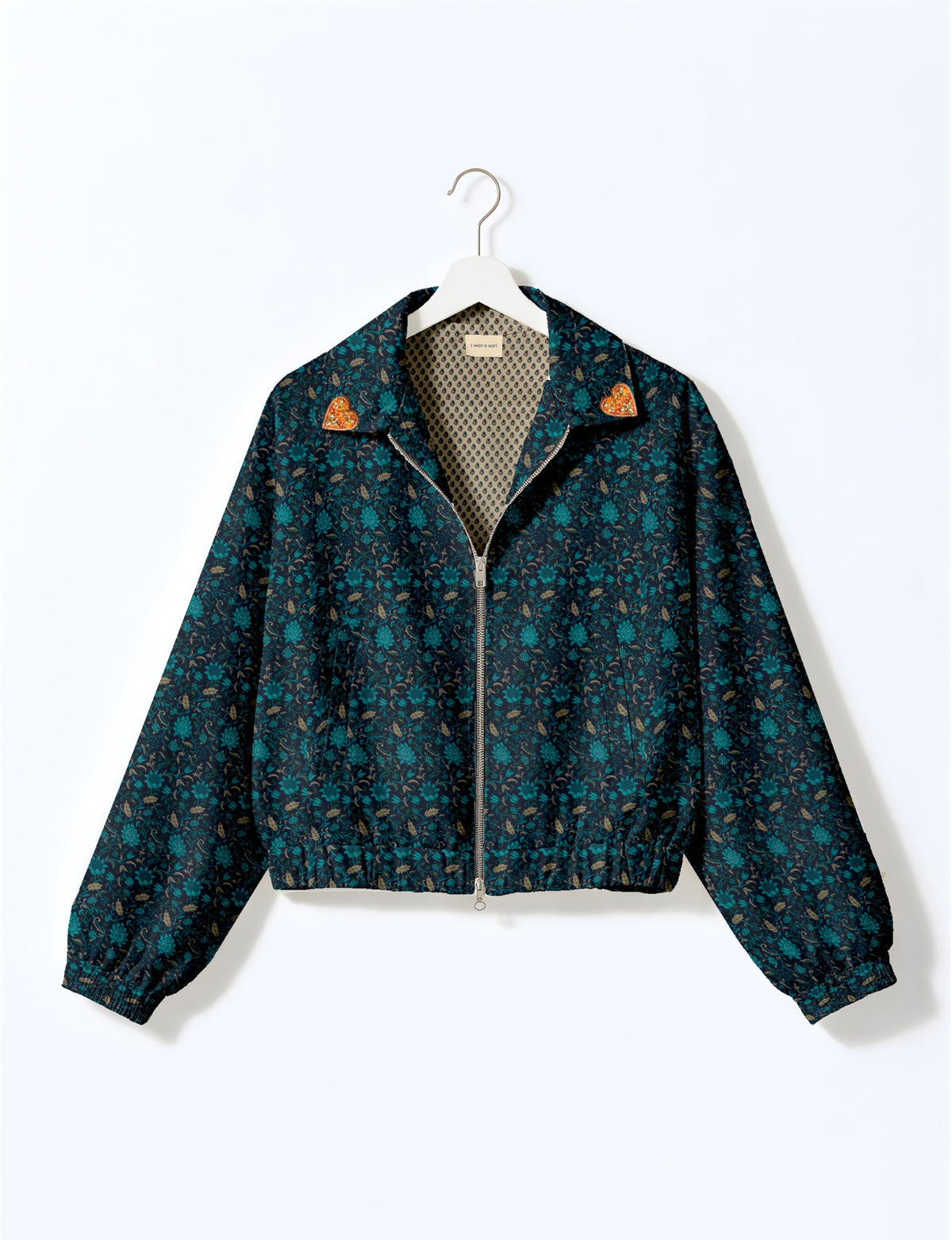 Love Bomber Jacket made from recycled fabric, featuring hand-stitched Aari embroidery. A unique piece of zero-waste clothing, part of the circular fashion movement. Designed with upcycled materials for a stylish yet environmentally friendly clothing choice.