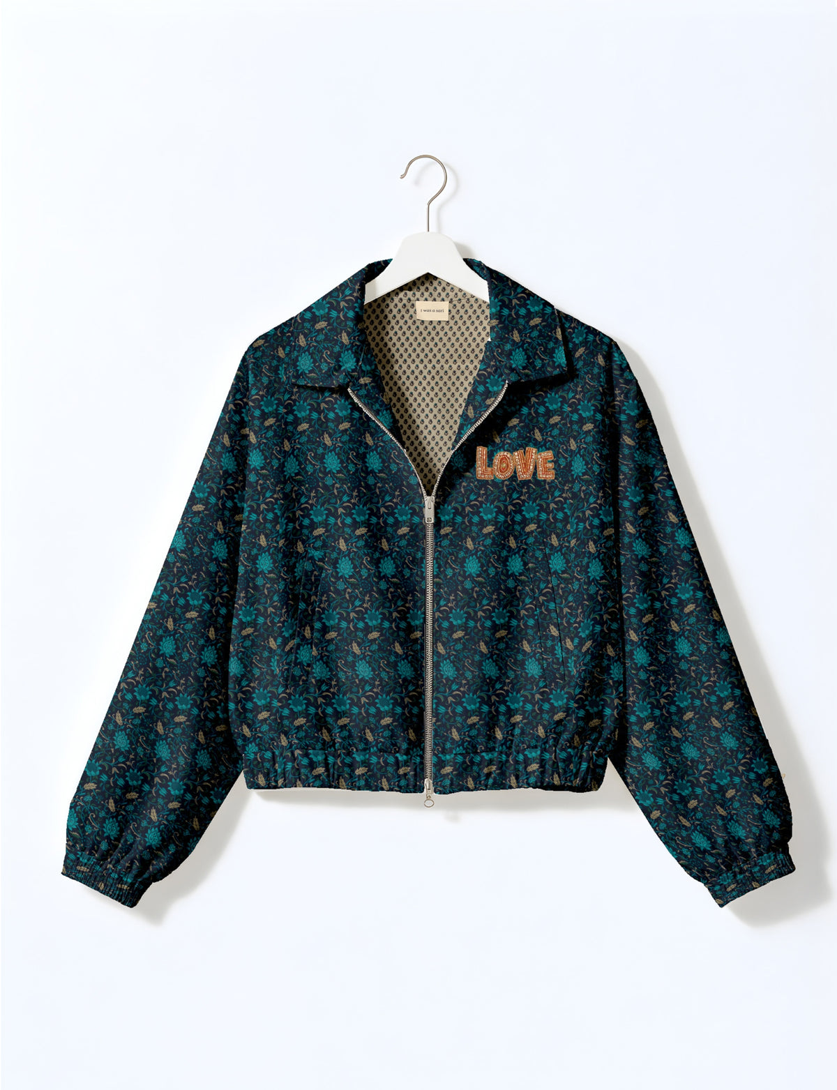 Love Bomber Jacket made from recycled fabric, featuring hand-stitched Aari embroidery. A unique piece of zero-waste clothing, part of the circular fashion movement. Designed with upcycled materials for a stylish yet environmentally friendly clothing choice.