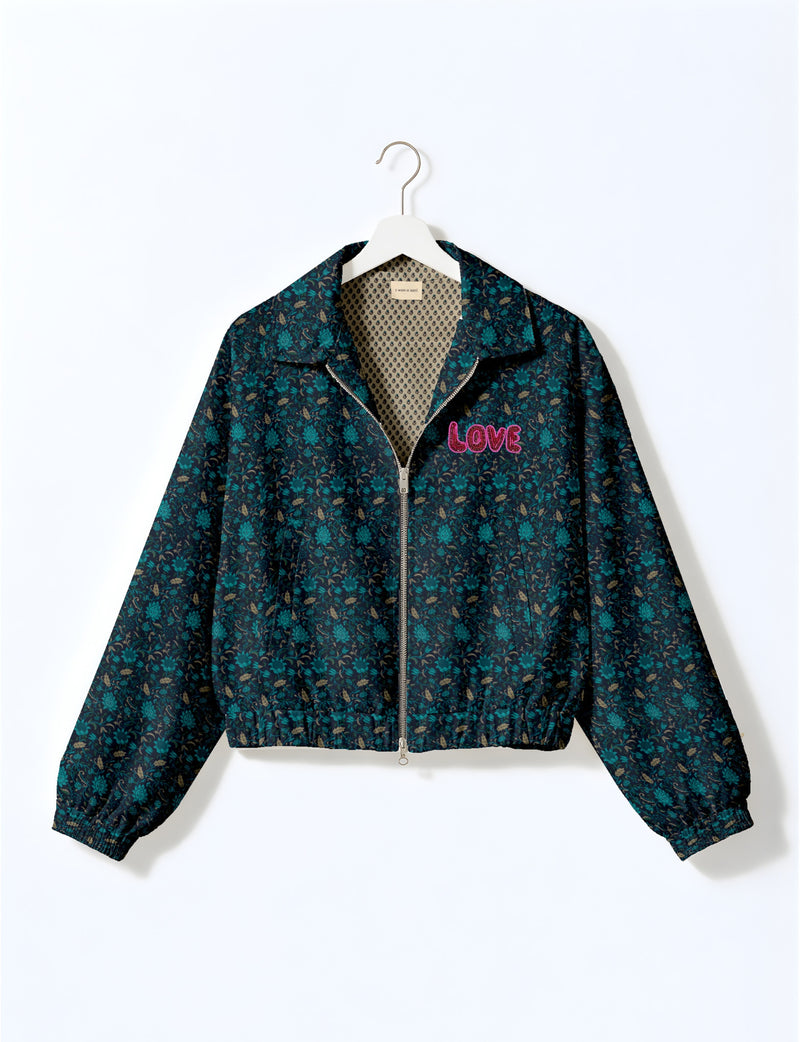 Love Bomber Jacket made from recycled fabric, featuring hand-stitched Aari embroidery. A unique piece of zero-waste clothing, part of the circular fashion movement. Designed with upcycled materials for a stylish yet environmentally friendly clothing choice.