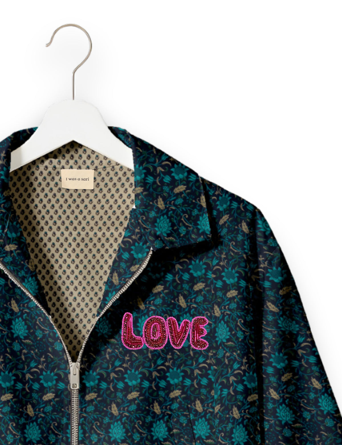 Love Bomber Jacket made from recycled fabric, featuring hand-stitched Aari embroidery. A unique piece of zero-waste clothing, part of the circular fashion movement. Designed with upcycled materials for a stylish yet environmentally friendly clothing choice.