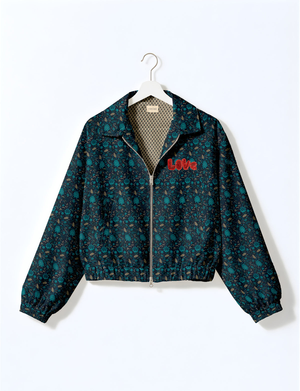 Love Bomber Jacket made from recycled fabric, featuring hand-stitched Aari embroidery. A unique piece of zero-waste clothing, part of the circular fashion movement. Designed with upcycled materials for a stylish yet environmentally friendly clothing choice.