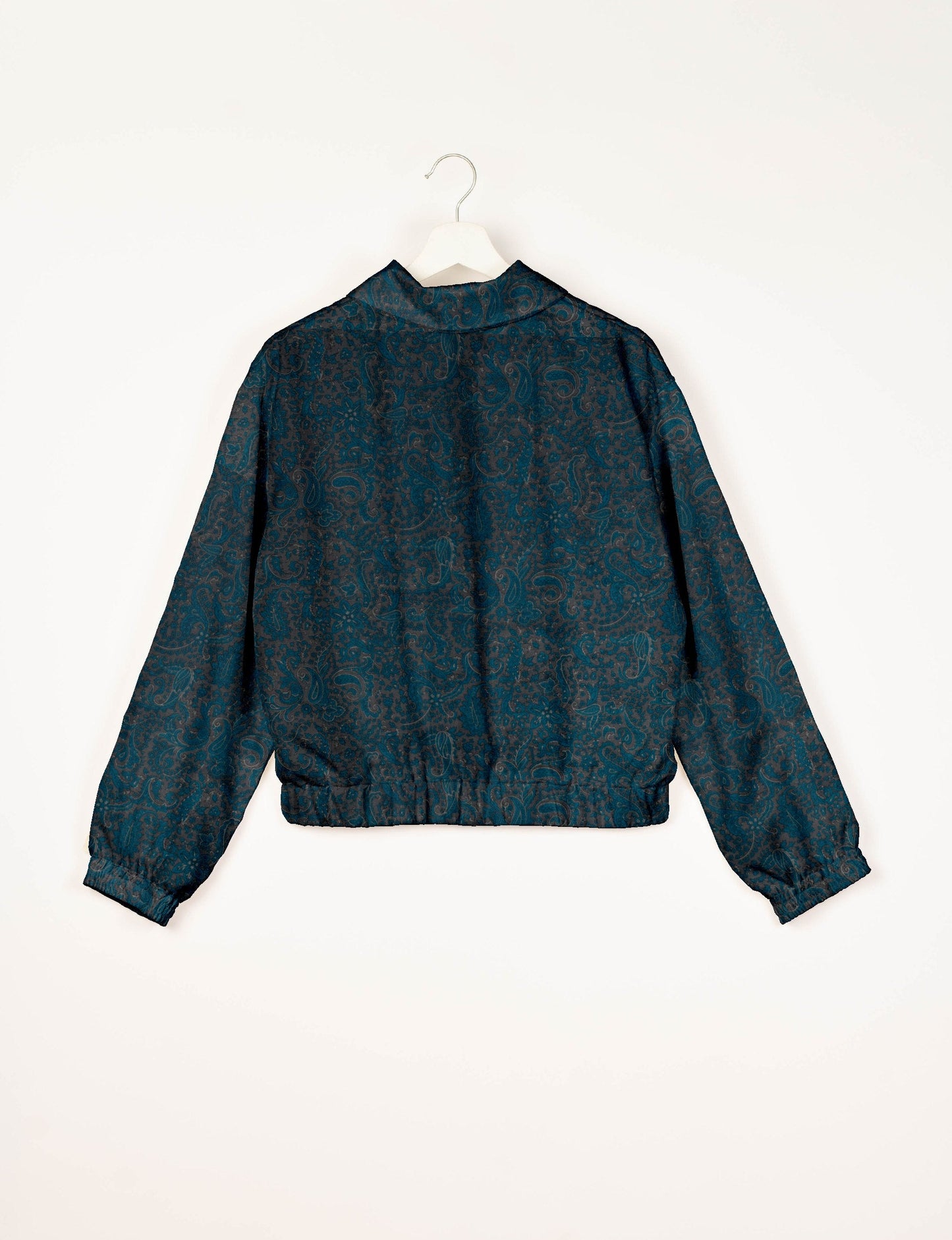 Upcycled Bomber Jacket made from recycled sari materials, featuring a cute cropped shape, elasticated hem and cuffs, and contrast sari print lining. Sustainable apparel promoting eco-friendly fashion and ethical clothing.