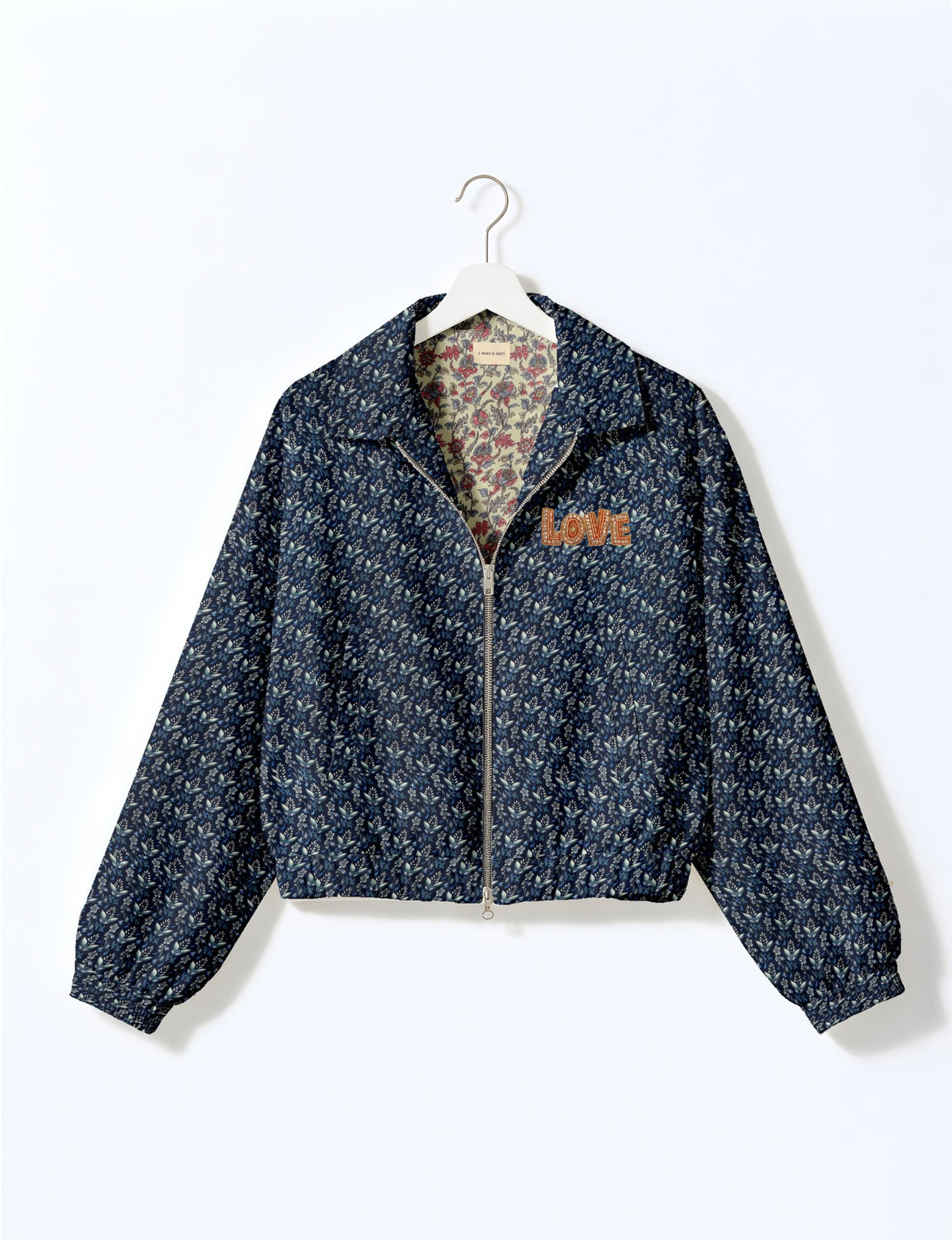 Love Bomber Jacket made from recycled fabric, featuring hand-stitched Aari embroidery. A unique piece of zero-waste clothing, part of the circular fashion movement. Designed with upcycled materials for a stylish yet environmentally friendly clothing choice.