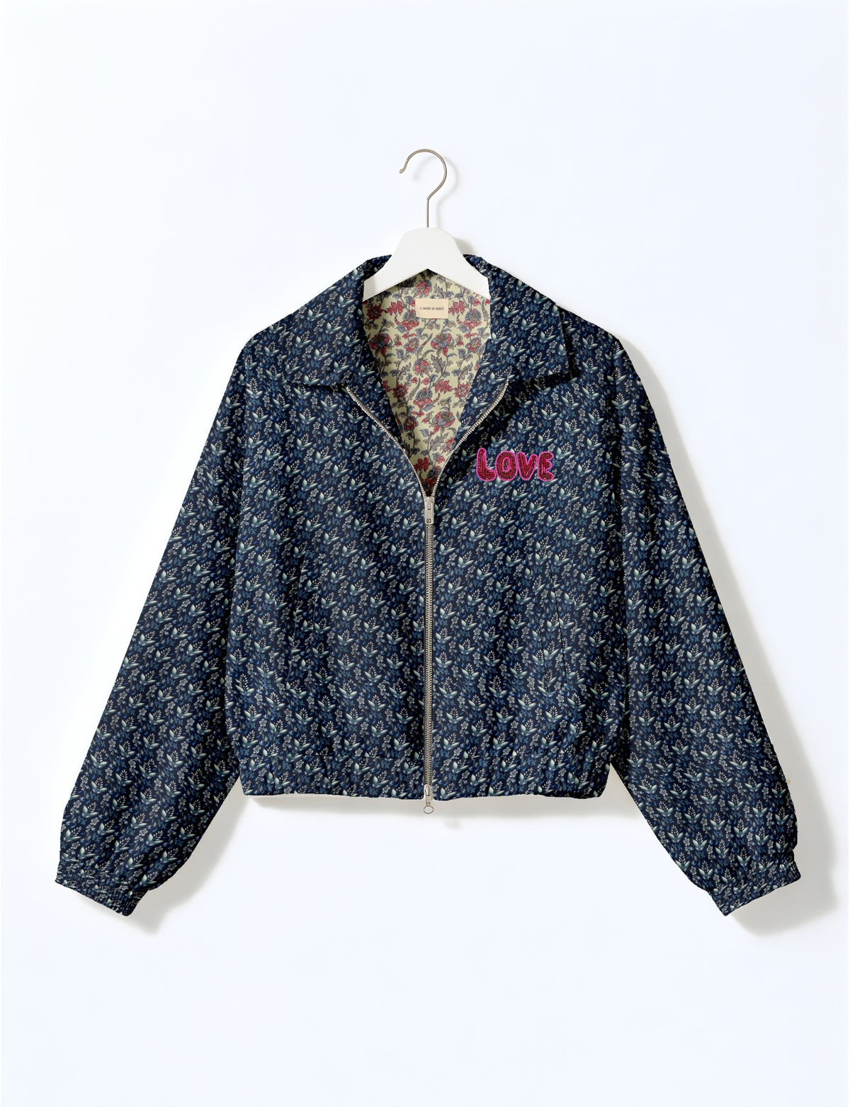 Love Bomber Jacket made from recycled fabric, featuring hand-stitched Aari embroidery. A unique piece of zero-waste clothing, part of the circular fashion movement. Designed with upcycled materials for a stylish yet environmentally friendly clothing choice.