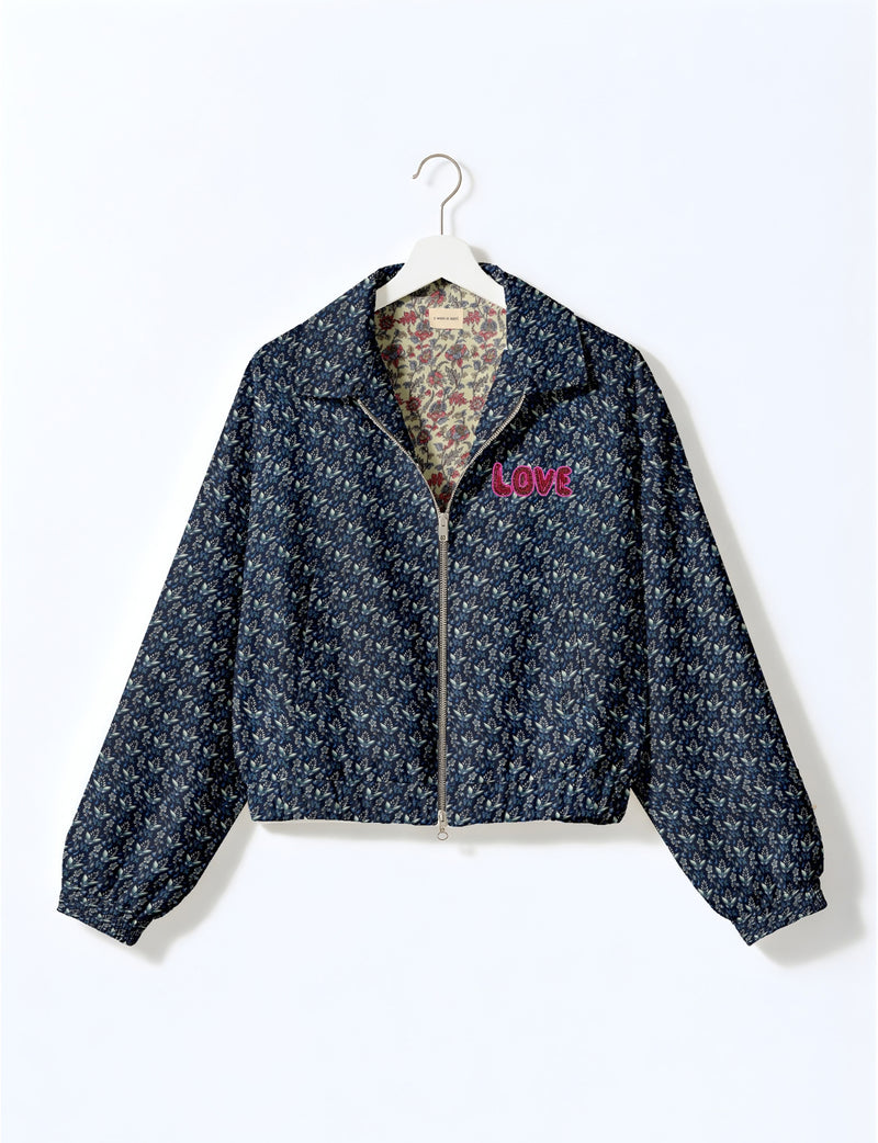 Love Bomber Jacket made from recycled fabric, featuring hand-stitched Aari embroidery. A unique piece of zero-waste clothing, part of the circular fashion movement. Designed with upcycled materials for a stylish yet environmentally friendly clothing choice.