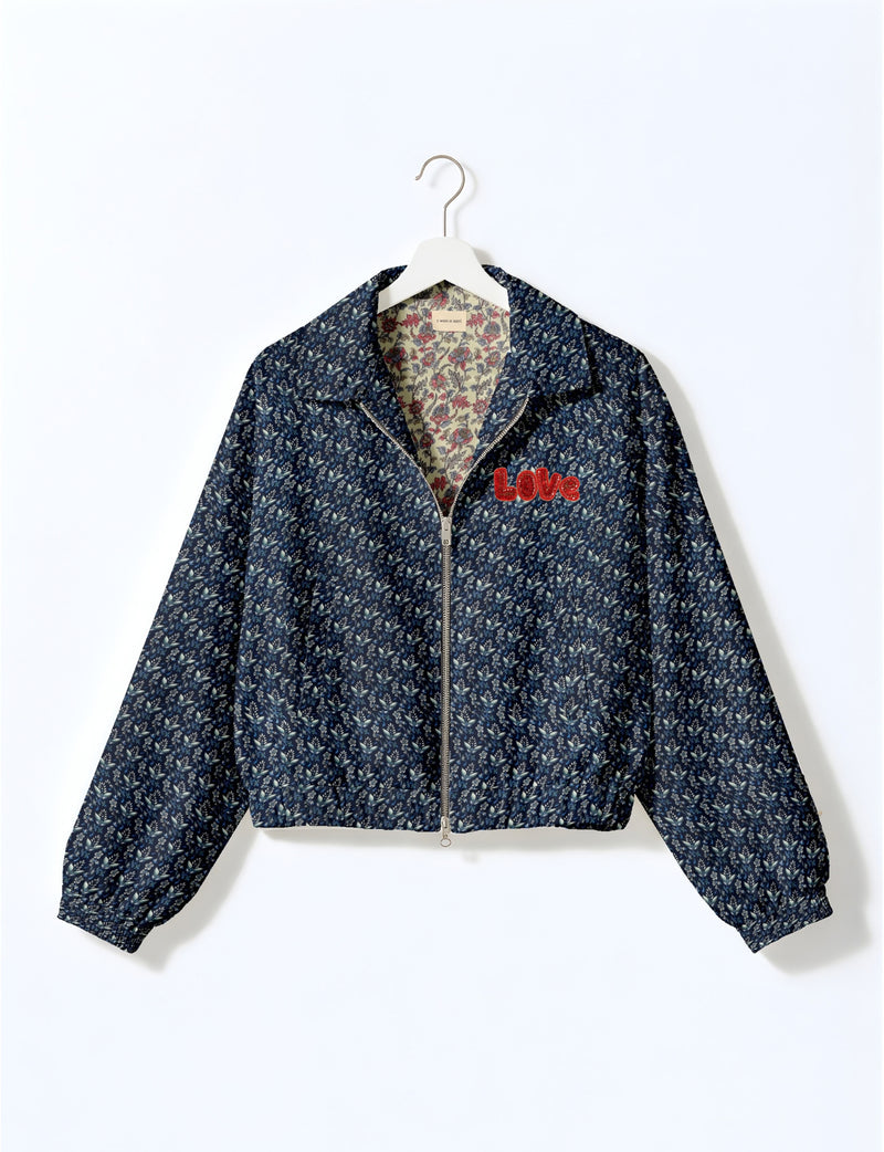 Love Bomber Jacket made from recycled fabric, featuring hand-stitched Aari embroidery. A unique piece of zero-waste clothing, part of the circular fashion movement. Designed with upcycled materials for a stylish yet environmentally friendly clothing choice.