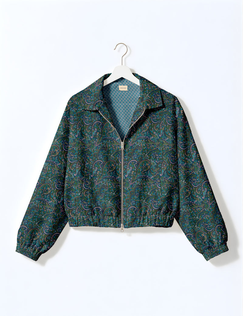 Brown floral bomber jacket with front zipper, elastic cuffs and hem, hanging on white hanger, red floral inner lining visible