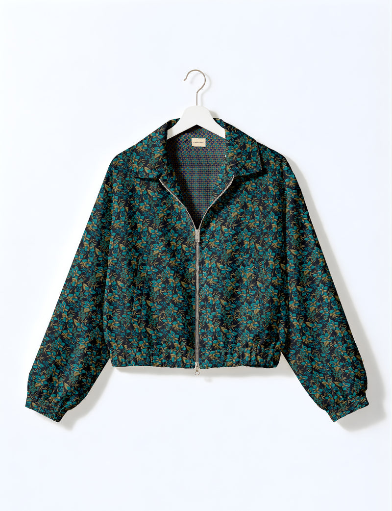 Brown floral bomber jacket with front zipper, elastic cuffs and hem, hanging on white hanger, red floral inner lining visible
