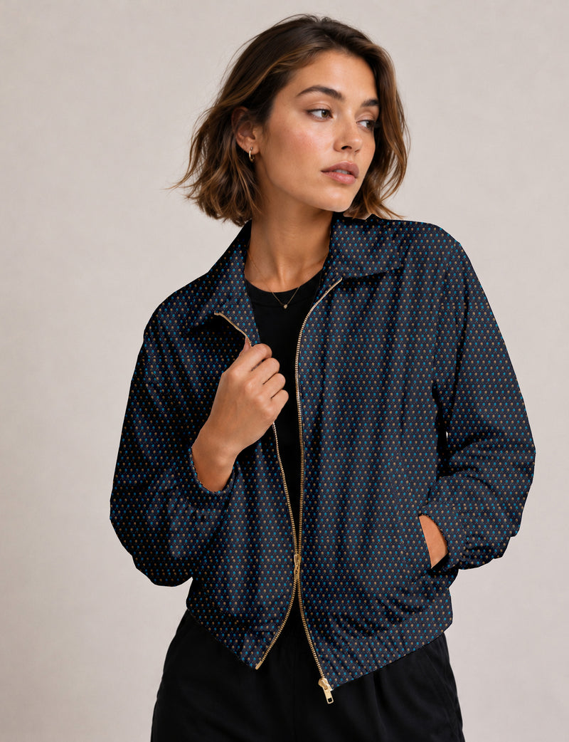 Woman wearing a yellow floral bomber jacket with front zipper, elastic cuffs, and side pockets, shown from front view