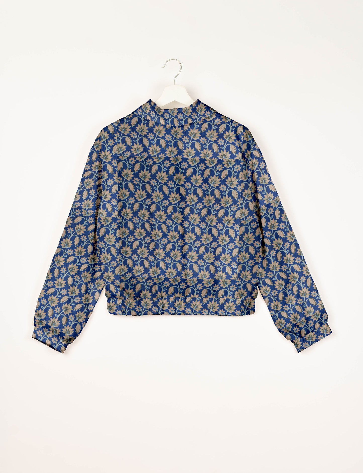 Upcycled Bomber Jacket made from recycled sari materials, featuring a cute cropped shape, elasticated hem and cuffs, and contrast sari print lining. Sustainable apparel promoting eco-friendly fashion and ethical clothing.