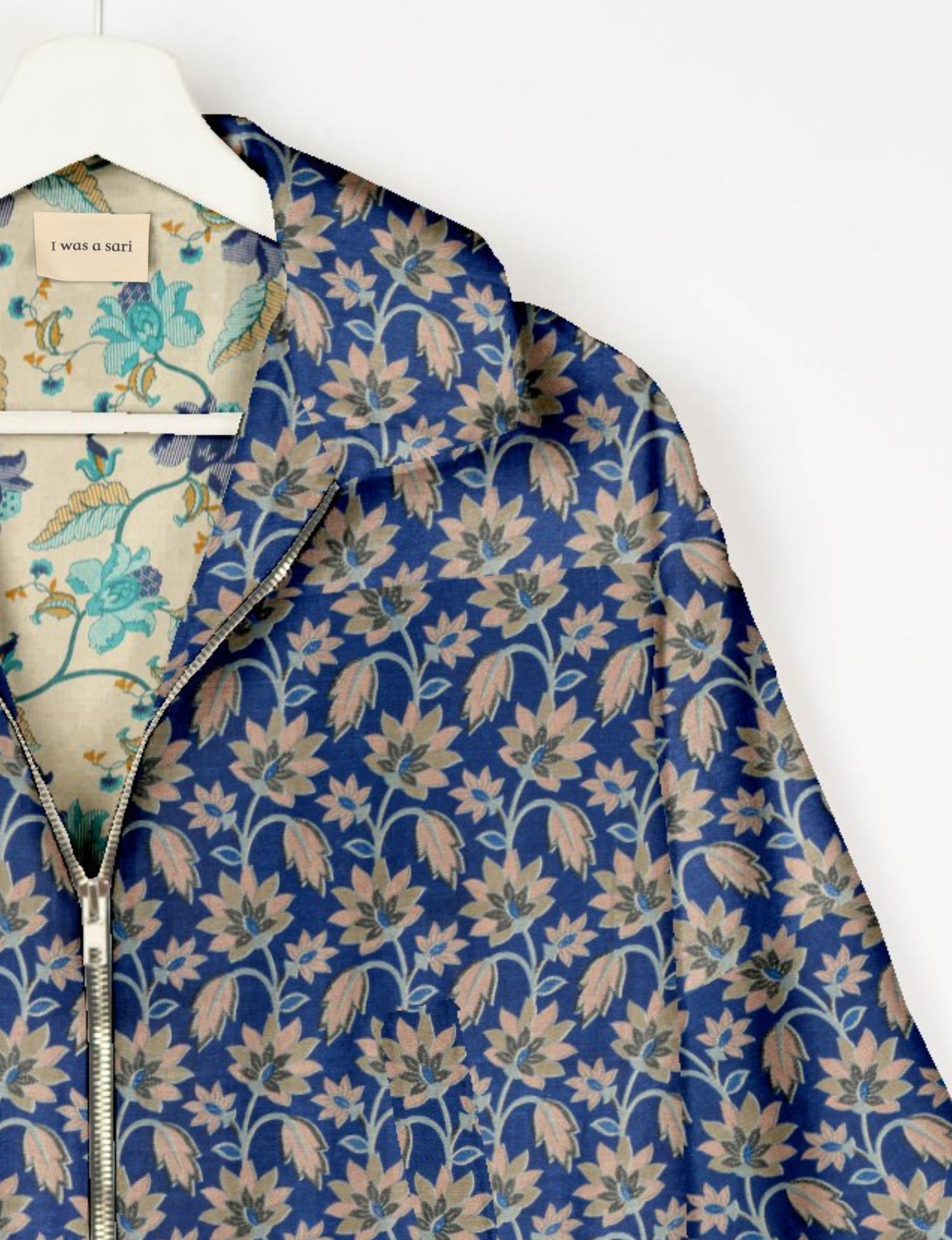 Upcycled Bomber Jacket made from recycled sari materials, featuring a cute cropped shape, elasticated hem and cuffs, and contrast sari print lining. Sustainable apparel promoting eco-friendly fashion and ethical clothing.